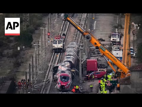 Video Thumbnail: Drone footage shows cranes lifting Iryo train wreckage at train crash site in Spain