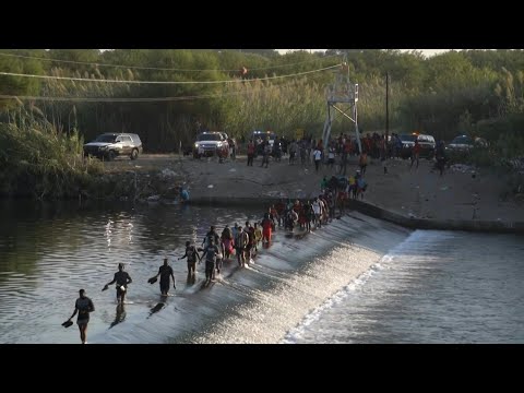 Migrants crossing Rio Grande to US border from Mexico | AFP