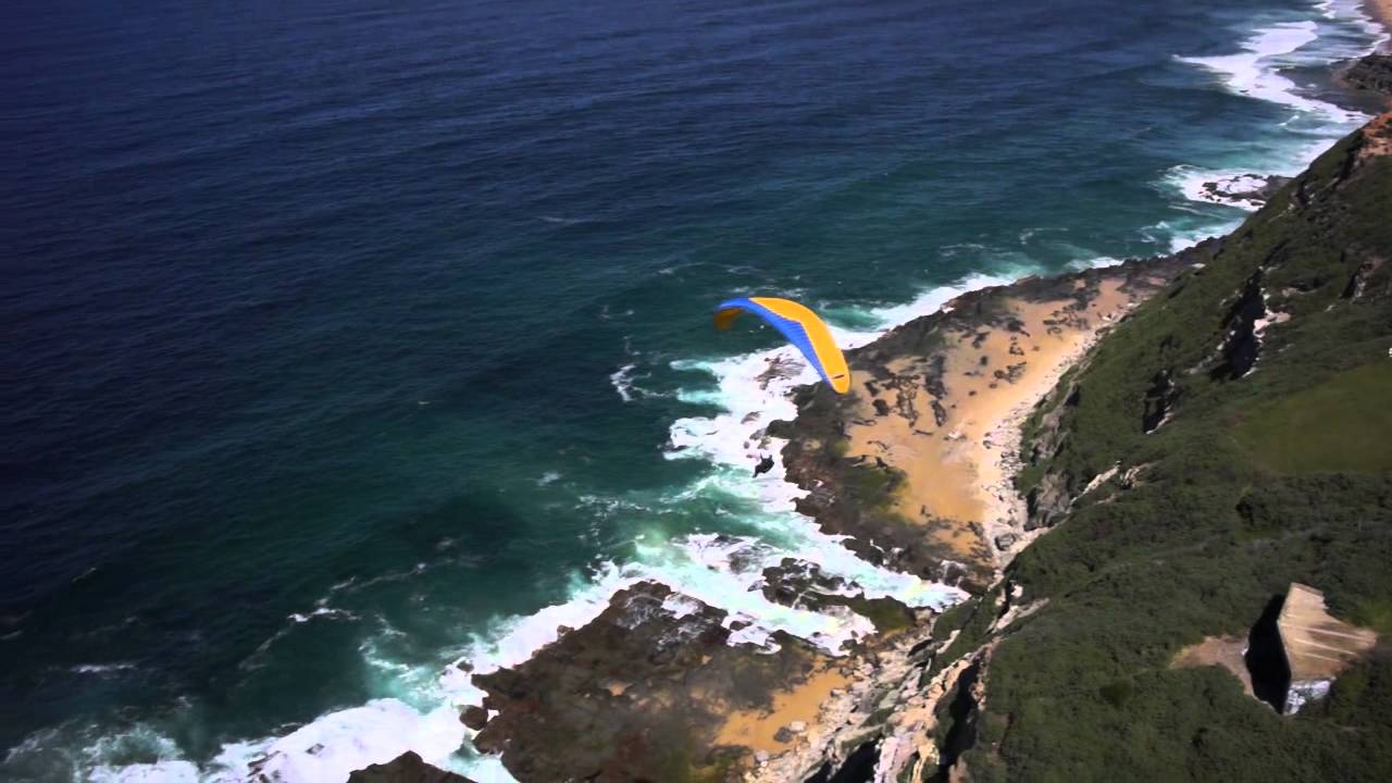 Glide over Newcastle coastline with stunning ocean views.