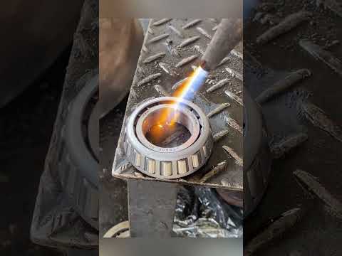 Use the principle of thermal expansion and contraction to install the gearbox bearings.
