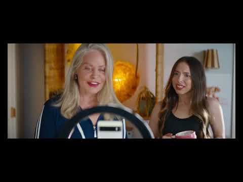 Trailer frame: June filming herself on phone; music cues bridge narration and action