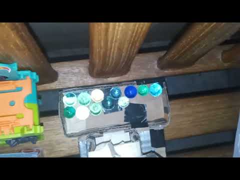 6983: Flushing marbles down the toilet on The Cheesecake Factory Bench, Bella Terra