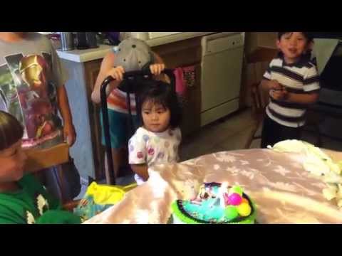 Blowing her cake with friends