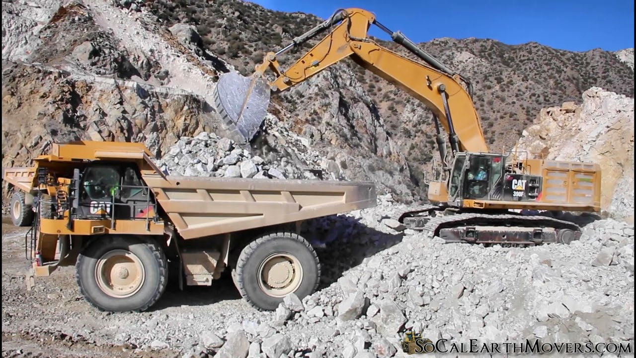 CAT 390F LME loading re-powered tier 4 777F up in the mountains