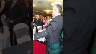 Groom sings to bride down the aisle