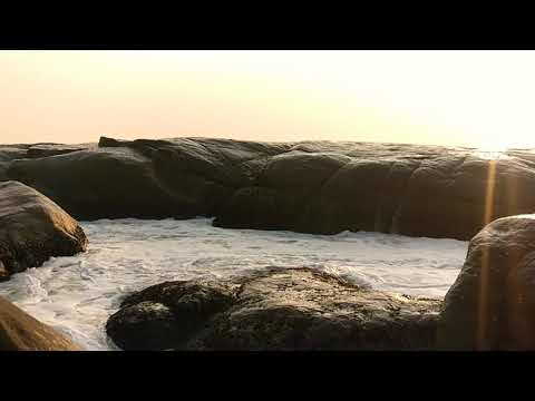 Slowmotion - Sea water flows over Rock at Someshwara Beach