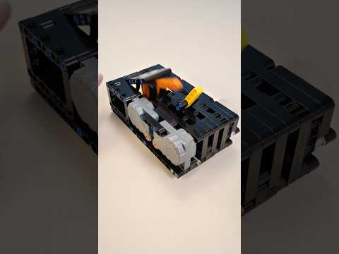 Building a LEGO useless machine via instruction from  www.youtube.com/@poemes. #lego