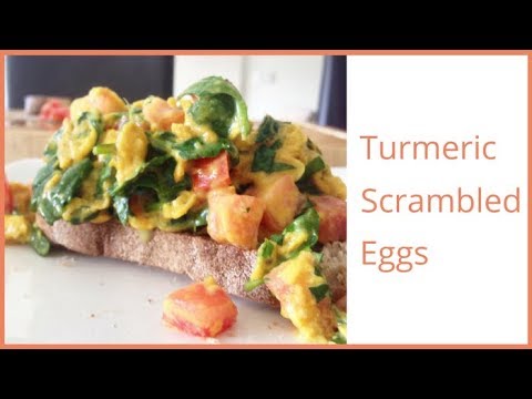 Healthy turmeric scrambled eggs with spinach & tomato