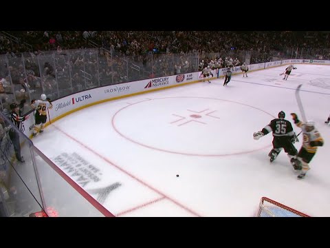 Darcy Kuemper sticks a skate out at David Pastrňák after the OT winner.