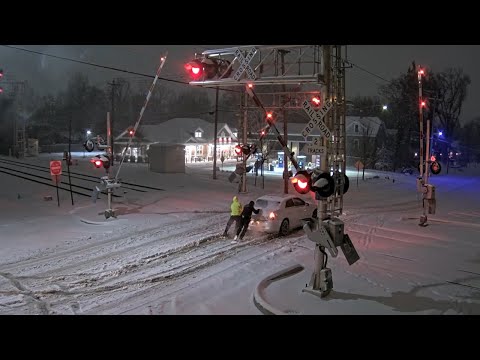 Good Samaritans Save Car from Being Hit by Freight Train!