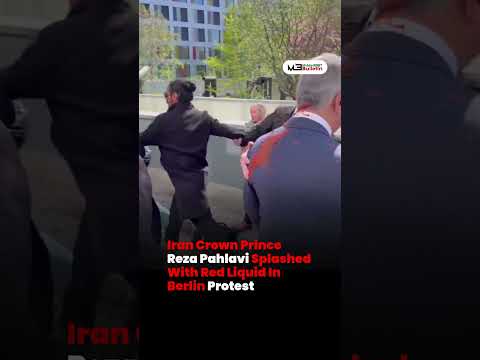 Iran’s Crown Prince Reza Pahlavi Splashed With Red Liquid During Berlin Protest