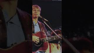 John Denver speaks to audience: Falling Leaves