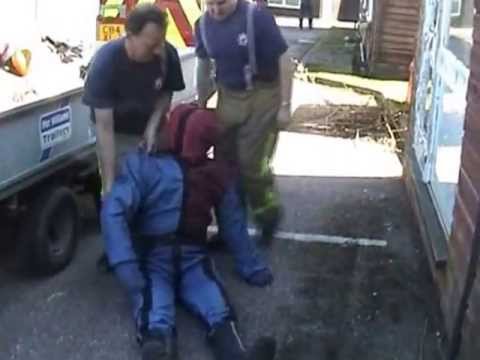 Drag dummy being placed back on trailer after training session mannequin-man performming as a drag dummy: Video clip of drag dummy being placed back on trailer after training session - Event Fire & Rescue Redhill Aerodrome for Event Fire & Rescue on 02/04/2005