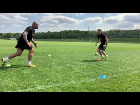 Netani Talei (Fiji rugby) and Karl Dickson perform a Rugby drill to help with your tackling