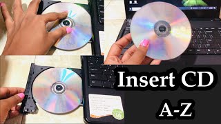 How to Insert CD in to Dell Laptop Computer | How to Play CD in Dell Laptop