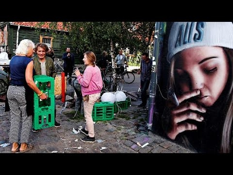 Residents of Copenhagen's Christiania demolish cannabis huts after shooting