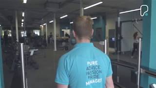 PureGym Barnstaple: Turf area with plyo boxes, medicine balls, functional training rig, and motivational signage.