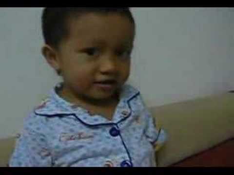 Aidi is trying to remember 1,2,3, a,b,c alif baa taa