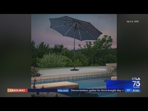 Part of a video titled Patio umbrellas sold at Costco recalled after reports of fires