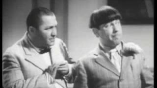 Three Stooges:  Moe puts Curly's head in a letterpress