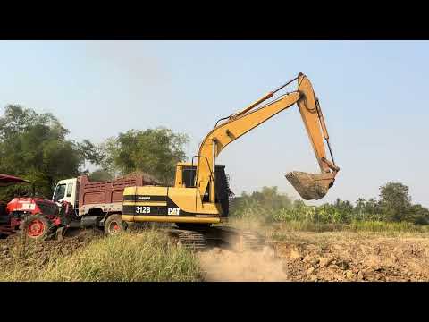 Huge Liebherr 984 Excavator Loading Caterpillar 777C-D Dumpers - Drone View