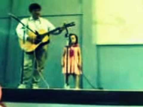 3 year old kid performing song on stage