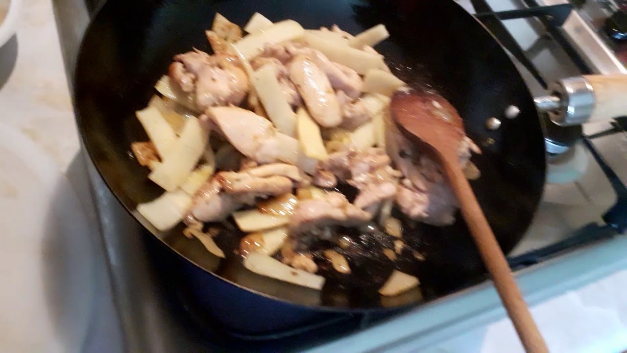 Stir fry bamboo shoots and water chestnuts with striped chicken breast in Avocado oil