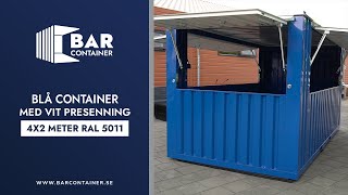 Blå container med extra vit presenning