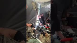 Army Use Strength to Hold Down Tent
