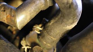 Difficult coolant leak repair on a 1995 Nissan pickup.