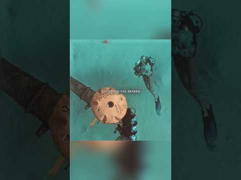 While the man was diving into the water, suddenly his precious watch fell into the water.