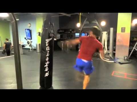 kicks on heavy bag by Emilien De Falco