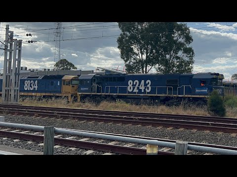 8243-8134 on a loaded Pacific National Garbage train passing Campbelltown NSW 15-12-2022