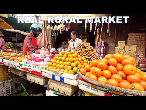 Rural Market Day in Phav Market, Cambodia A large number of poultry and peculiar foods on the scene