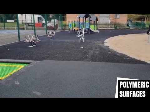 Black Wetpour With Green Fleck Installation in Wales | Wetpour Surfacing