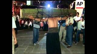 Penitents carry crosses in Mexico Easter procession