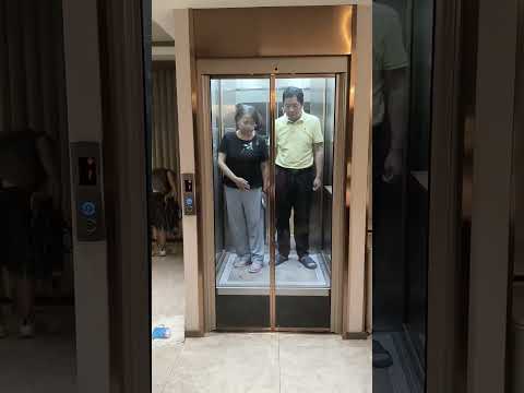 A home elevator with Electric double doors.