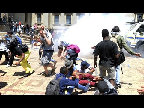 Click to Watch the Jesuit priest takes bullets to face in violent protest video