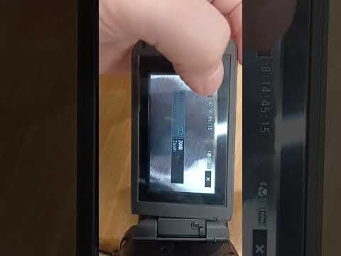 how to insert and clear an SD card in a Canon xa11 camcorder