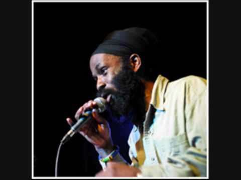 Ras Kofi featuring Sunz of light - Materialist