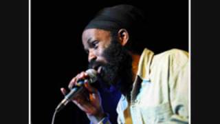 Ras Kofi featuring Sunz of light - Materialist