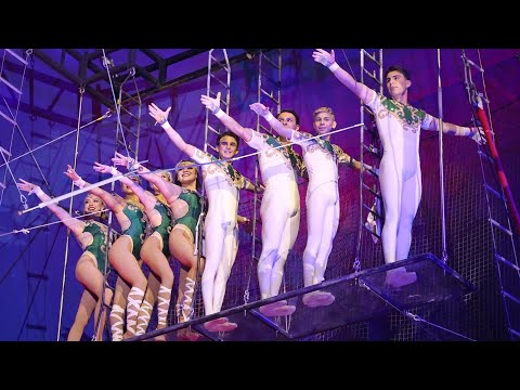 DOUBLE WIDE FLYING TRAPEZE ACT BY THE FLYING CABALLERO, 2 QUADRUPLES SOMERSAULTS SIMULTANEOUSLY.