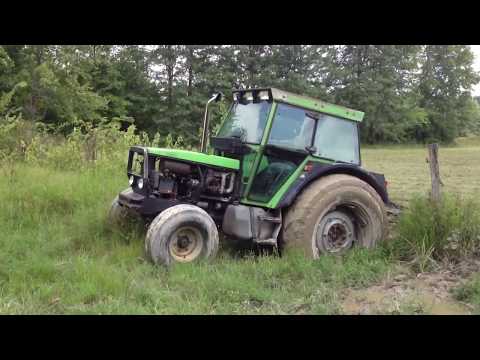 Backhoe Pulls Out Tractor Stuck In Mud!  Live Action!