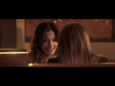 Trailer close-up: Rebecca’s fixed stare in cool-blue palette, strings tightening