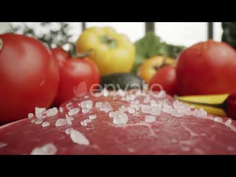 Zoom out macro video of sea salt on raw steak. Shot with RED helium camera in 8K | Stock Footage...