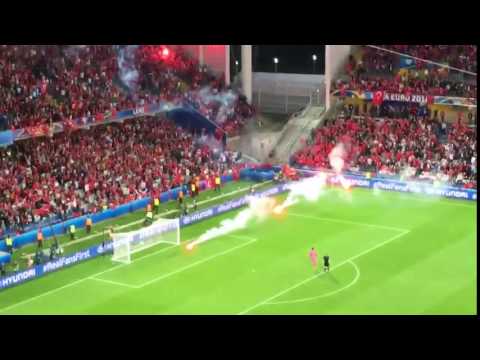 Turkish fans throw flares onto the pitch during Czech Republic vs Turkey EURO2016