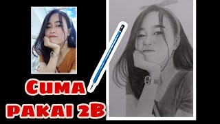 Menggambar wajah dengan pensil 2B