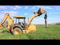 Using our backhoe on the farm | Backhoe digging and loading