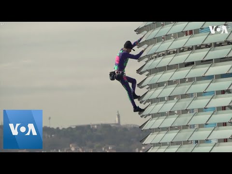Urban Climber Scales Barcelona Building To Spotlight Coronavirus Paranoia