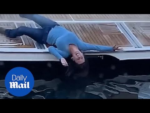 Drunk woman stumbles from docked boat into water in hilarious footage